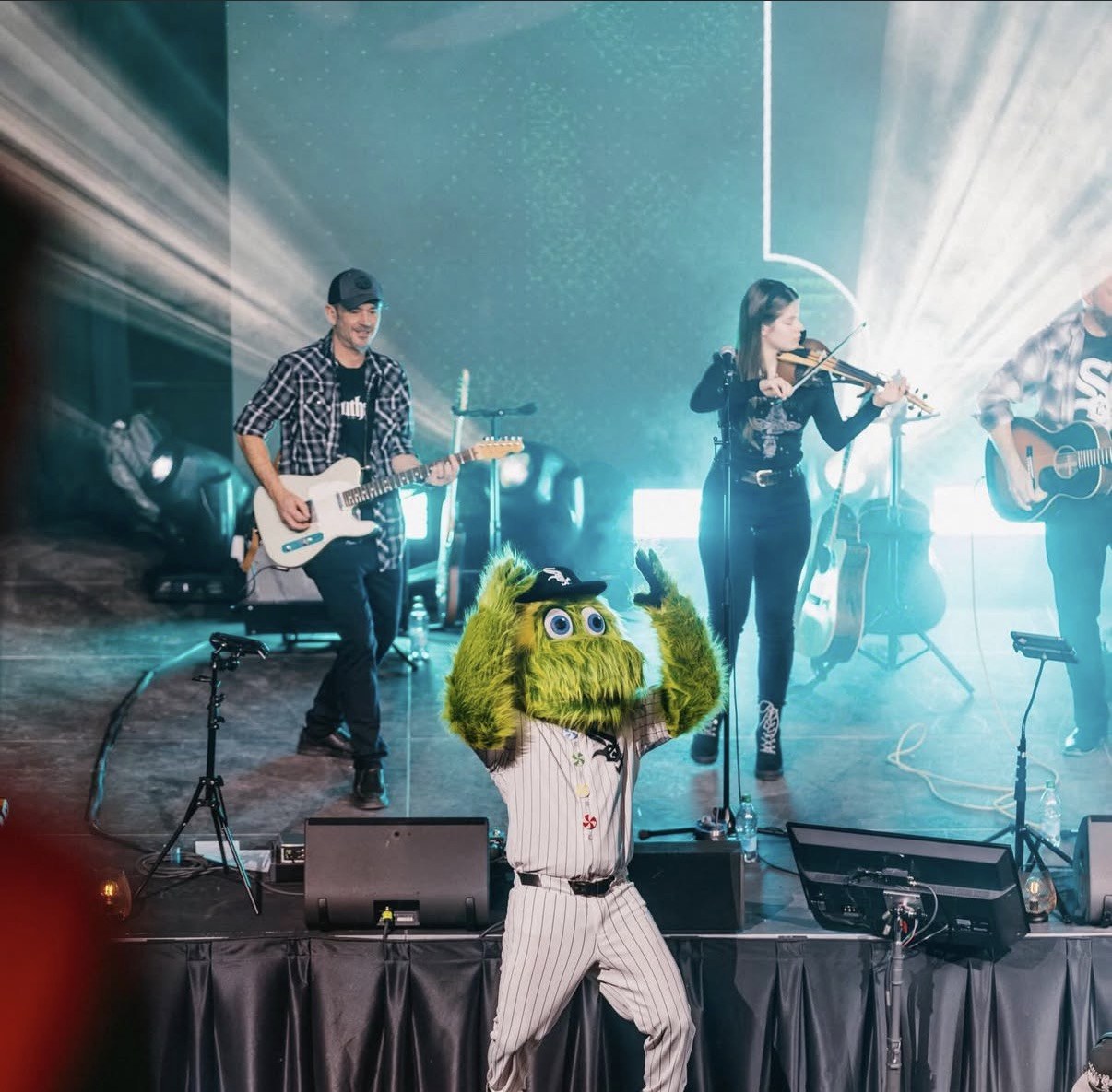 Live branded entertainment event with performers and sports mascot