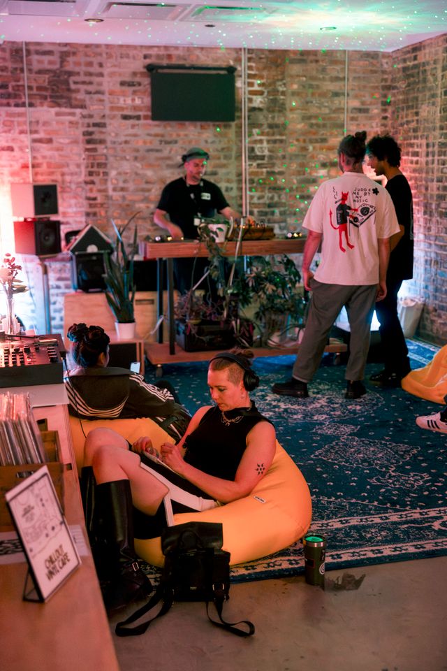 Relaxed private event lounge with a DJ and guests